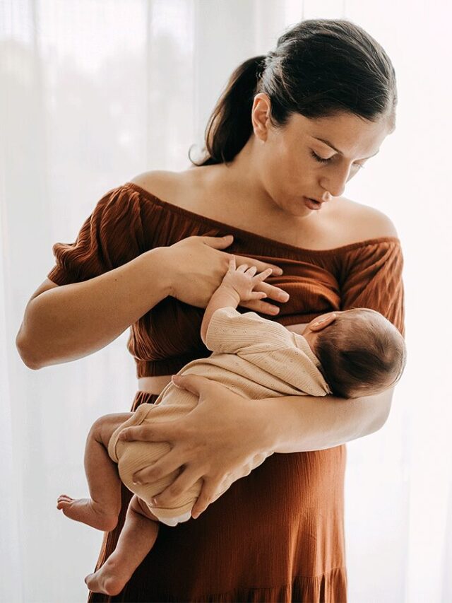 64c844136e763e077e5c731d_woman-breastfeeding-baby-at-home