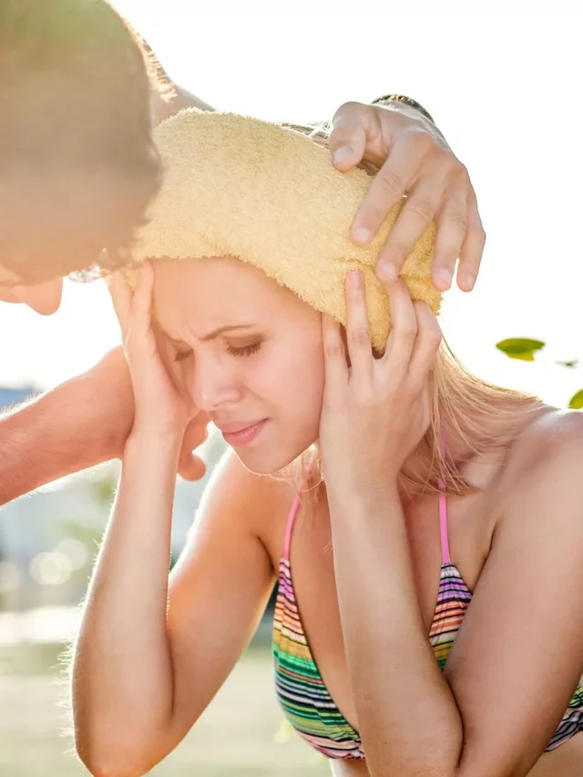0_Man-helping-woman-in-bikini-with-heatstroke-summer-heat