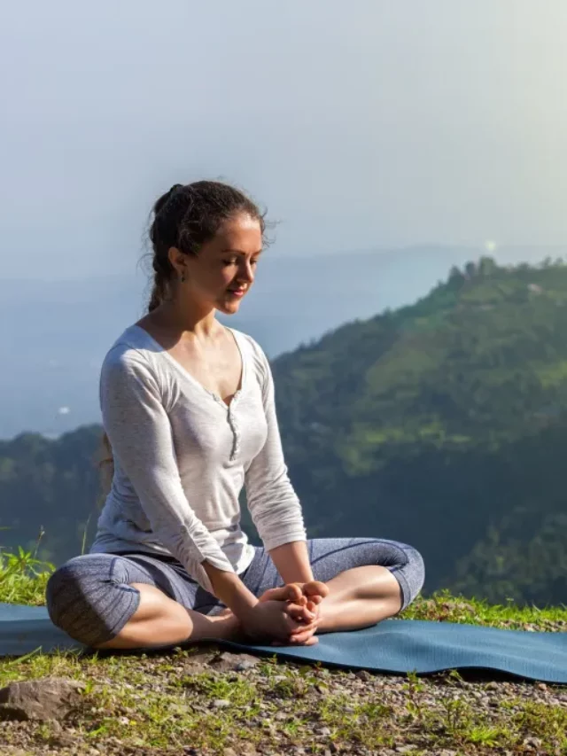 woman-practice-yoga-asana-baddha-konasana-outdoors