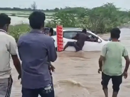 Car Swept Away In Rain Water