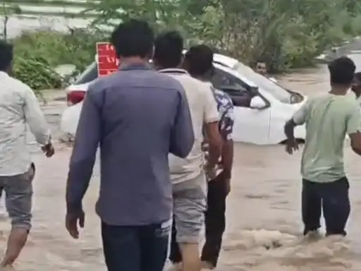 Car Swept Away In Rain Water